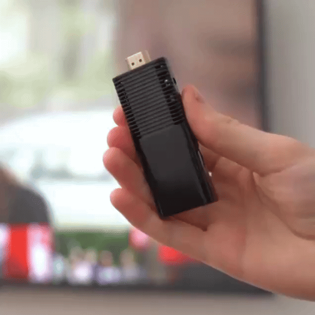 FlixyTV Smart Stick being held in hand